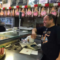 <p>Longtime Vitamia customer Rosario Gentiluomo, left, catches up with co-owner Paul Vitamia in the Lodi shop.</p>