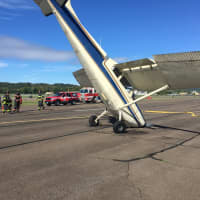 <p>A small aircraft lands on its nose after a rough landing at Danbury Airport on Friday morning.</p>