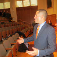 <p>Dutchess County Executive Marc Molinaro talks to several county employees on Wednesday after he introduced his tentative budget for 2016 at Fusco Recital Hall, Marist College. It includes more money for tourism and major bridge and road projects. </p>