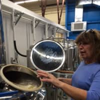 <p>Tess Szamatulski explains the brewing process at Veracious.</p>