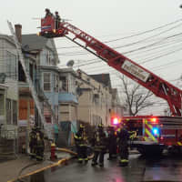 <p>Firefighters respond to a Paterson blaze on Walnut Street Wednesday, Dec. 23. </p>