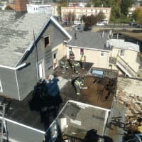 <p>Bridgeport firefighters demolish a blighted building on Newfield Avenue.</p>