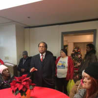 <p>The Rev. David O. Miller addresses guests at the Christmas Luncheon at New Hope Baptist Church.</p>