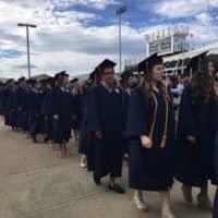 <p>The Class of 2016&#x27;s processional heads for the commencement exercises at Weston High.</p>