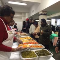 <p>Volunteers serve guests at the annual New Hope Baptist Church Christmas Luncheon.</p>