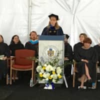 <p>Superintendent Colleen Palmer speaking at her last graduation at Weston High. she is leaving this month to take the top job in Westport.</p>