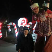 <p>Brenn Swanson, a Westchester County Parks worker on stilts, greets Winter Wonderland visitors form the Bronx, and offered a rundown of all they could see at Kensico Dam Plaza on Saturday. The fest resumes Thursday thru Dec. 23, &amp; Dec. 26 thru Jan. 3.</p>