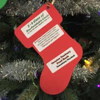 <p>The Christmas tree in the Western Connecticut State University midtown campus student center is decorated with ornaments that list items needed by the Greater Danbury Food Bank.</p>