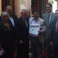 <p>Many of the new citizens took photos with the elected officials following the naturalization ceremony in Norwalk</p>