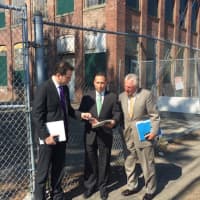 <p>State Rep. Chris Perone, State Sen. Bob Duff and Norwalk Mayor Harry Rilling outside the mill building that will be renovated to become the SoNo Life Center.</p>
