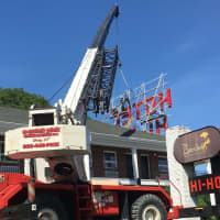 <p>A crane lifts the letters into place for the new Hi-Ho sign. The LED sign replaces the iconic neon one on the roof of the hotel.</p>