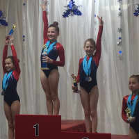 <p>Darien YMCA Level 4 Gymnasts swept the All-Around podium in the 8-9 age group at the Wilton Snowflake Invitational. L-R, Ali Kolman, third: Lauren Smith, first; Alexia Buchesky, second; and Julia Decsi, fourth.</p>