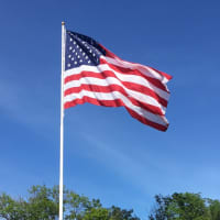 <p>The new flag flying high over downtown Danbury is 30 feet by 50 feet.</p>