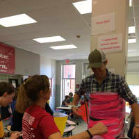 <p>Ridgewood&#x27;s BFMS officials tape Dan Cermac to the wall to raise money for breast cancer during lunch on Oct. 30.</p>