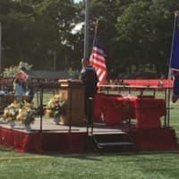 <p>Principal John Dellapiano III — and Master of Ceremonies — takes the podium at the Stratford High graduation.</p>