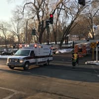 <p>An ambulance leaves the scene at about 8:10 a.m. after a woman was hit by a train at the Valhalla Metro-North station on Monday.</p>