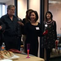 <p>Carol Dannhauser, center, speaks at the opening of the Fairfield County Writers&#x27; Studio, as First Selectman Jim Marpe, left, looks on.</p>
