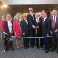<p>Officials gather for a ribbon cutting at alumni hall at Pace University. </p>