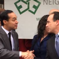 <p>HUD Secretary Julian Castro shakes hands with Bridgeport Mayor Joseph Ganim at the opening of Milestone Apartments.</p>