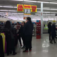 <p>Shoppers browse the liquidation sales at Kmart in Lodi.</p>