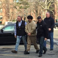 <p>Elmer Gomez Ruano is returned to Stamford Thursday and charged with the murder of his wife in November.</p>