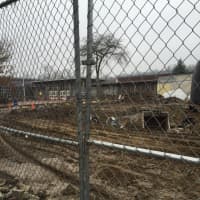 <p>Construction crews work to prepare the site of the old Greenwich High School auditorium Wednesday for construction of new classrooms.</p>