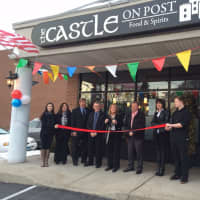 <p>State Rep. Brenda Kupchick cuts the ribbon at the grand opening of The Castle on Post in Fairfield.</p>