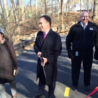 <p>First Selectman Peter Tesei cuts the ribbon on the West Old Mill Road Bridge Monday.</p>