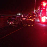<p>Firefighters work to extricate a driver after an accident on I-95 northbound Tuesday.</p>