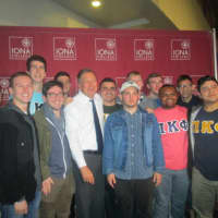 <p>Gov. John Kasich poses with supporters at a town hall in New Rochelle</p>