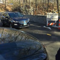 <p>First Selectman Peter Tesei was the first driver to cross the reconstructed West Old Mill Road Bridge following its opening Monday .</p>