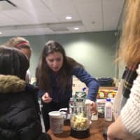 <p>Samantha Strelzer helps make a healthy smoothie in her nutrition seminar at Fairfield Public Library.</p>