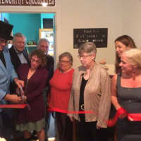 <p>The Sauvageaus cut the ribbon at the grand opening of their new business, Noteworthy Chocolates, in Bethel, as family members, supporters and town officials look on.</p>