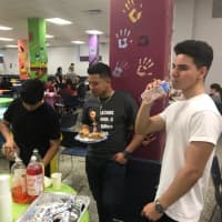 <p>Members of Port Chester High School&#x27;s Latinos Unidos Culture Club serve beverages at a fourth annual scholarship fundraising dinner on Thursday, May 3.</p>