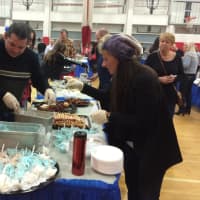 <p>Guests head for dessert at Benny&#x27;s Bakery and Ice Cream Shoppe&#x27;s table at Fair Lawn&#x27;s seventh-annual &quot;A Taste of Our Town&quot; Monday night.</p>