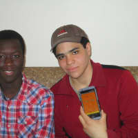 <p>Xavier Mendez and Filipe Fonseca of Mount Vernon show off their mobile app.</p>