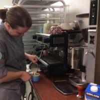 <p>Anna Llanos fixes a coffee drink at Mothership Bakery &amp; Cafe, 44 Old Ridgebury Road in Danbury. A new Mothership location will open on Main Street in November.</p>