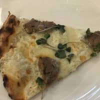 <p>A sampling of one of the pizza slices with meatballs at The Rex.</p>