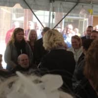 <p>Dr. Kristine Lisi, the center&#x27;s Medical Director, center facing camera, celebrates her birthday with the crowd at the dedication of the new health center in Danbury.</p>