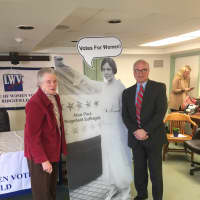<p>Ridgefield resident Josette Williams and First Selectman Rudy Marconi with a cutout of Alice Paul, a local suffragist, after a talk in town in January.</p>