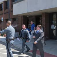 <p>Jean Pierre-Filtcher, 24, of New Rochelle and his attorney after Filtcher&#x27;s arraignment Tuesday afternoon at Harrison Town Court on menacing, disorderly conduct and obstructing governmental administration charges.</p>