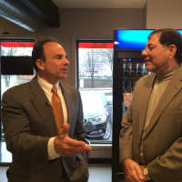 <p>Mayor Joseph P. Ganim talks business with Wing It On! owner Hosam Afifi.</p>