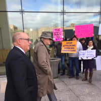 <p>Greenwich RTM member Christopher von Keyserling and his lawyer Phil Russell leave court on Wednesday morning through a line of protesters.</p>