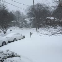 <p>Snow blanketed neighborhoods in Greenwich, covering streets, lawns and cars Saturday afternoon.</p>