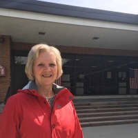 <p>Teaneck voter Suzanne McBride heads to the polls at Benjamin Franklin Middle School.</p>