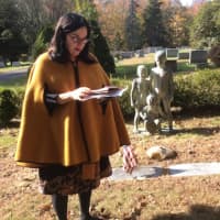 <p>Patricia Funt Oxman consults her research during the New Canaan Historical Society&#x27;s second annual cemetery tour Tuesday, Nov. 1.</p>