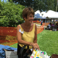 <p>Mimi Greenlee, one of the Westport Library Book Sale&#x27;s show runners, celebrates her 50th anniversary at the sale on Saturday.</p>