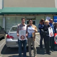 <p>Protesters gather outside Fidelity Investments in Paramus.</p>