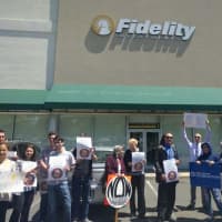 <p>Protesters gather outside Fidelity Investments in Paramus.</p>