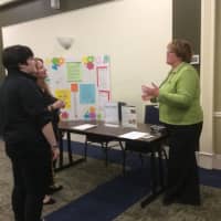 <p>Mary Johnson, right, a principal at a school that uses the Kind Campus program from Ben&#x27;s Bells, discusses the program with teachers visiting the reception prior to Jeannette Maré&#x27;s speech on kindness at WCSU.</p>